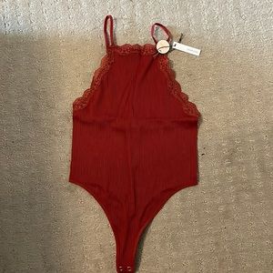 Woman’s NEW bodysuit